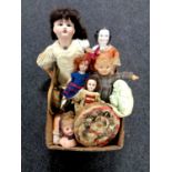 A box containing antique and later dolls including French bisque headed jointed doll etc