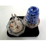 A tray containing silver plated cruet set on gallery stand,