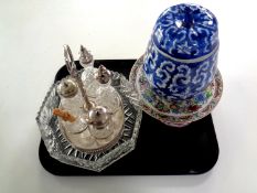 A tray containing silver plated cruet set on gallery stand,