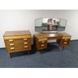 A mid century Uniflex Furniture four drawer chest together with matching dressing table