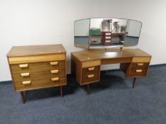 A mid century Uniflex Furniture four drawer chest together with matching dressing table