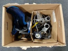 A box containing a quantity of motorcycle parts