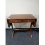 A reproduction mahogany sofa table