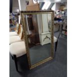 A bevelled gilt framed mirror