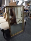 A bevelled gilt framed mirror