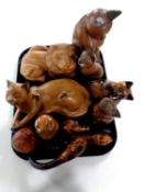 A tray containing a quantity of carved wooden cat ornaments,