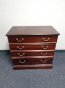 A reproduction mahogany four drawer chest