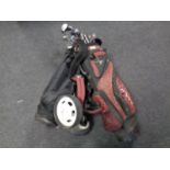 Two golf bags containing clubs
