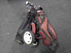 Two golf bags containing clubs