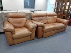 A good quality tan leather reclining two seater settee and matching armchair