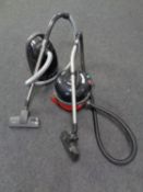 A Henry Numatic vacuum cleaner together with a Miele vacuum cleaner
