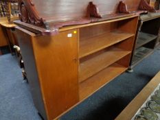 A mid century teak bookcase with cupboard