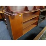 A mid century teak bookcase with cupboard