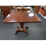 An early Victorian mahogany turnover topped tea table