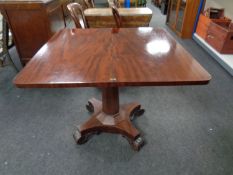 An early Victorian mahogany turnover topped tea table