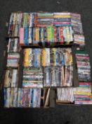 Seven boxes containing a large quantity of DVDs