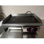 An electric table top griddle