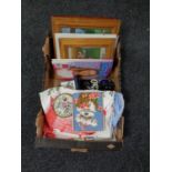 A box containing table linen, costume jewellery,