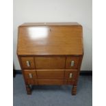 An early 20th century oak bureau