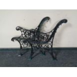 A pair of metal bench ends