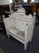A traditional style painted pine storage seat