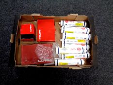 A box containing Firefly high temperature adhesive in tubes,