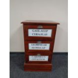 A reproduction three drawer chest with advertising decoration