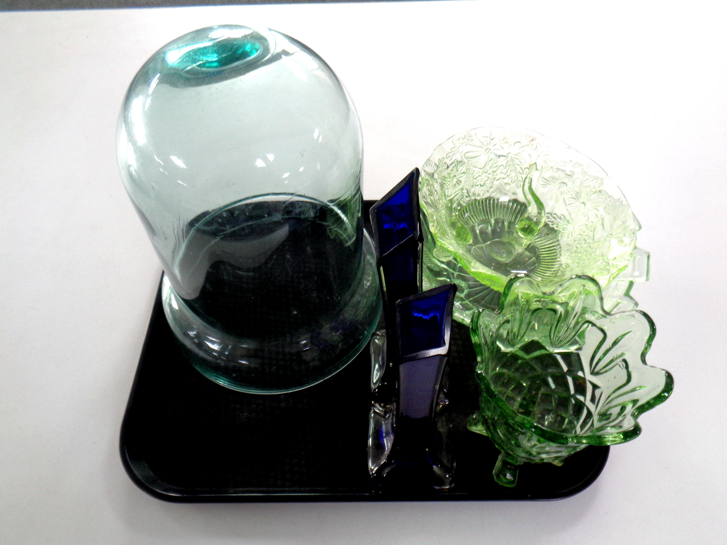 A tray of glassware to include pair of blue glass slender vases, green glass bowls,