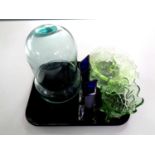 A tray of glassware to include pair of blue glass slender vases, green glass bowls,