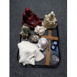 A tray containing ornamental Buddha figure, large shell,