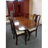 A Queen Anne style drop leaf table and four chairs