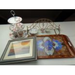 A tray containing cake stand, glass and brass shelf, china flower posy,