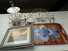 A tray containing cake stand, glass and brass shelf, china flower posy,