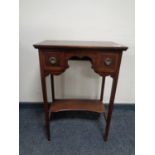 An inlaid mahogany two drawer table