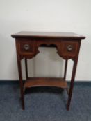 An inlaid mahogany two drawer table