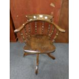 A traditional style swivel office chair