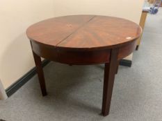 An antique mahogany circular table