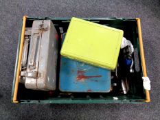 A plastic crate containing a collection of hand tools,