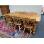 An antique style traditional pine farmhouse table and six pine chairs