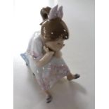 A Lladro figure depicting a girl on footstool