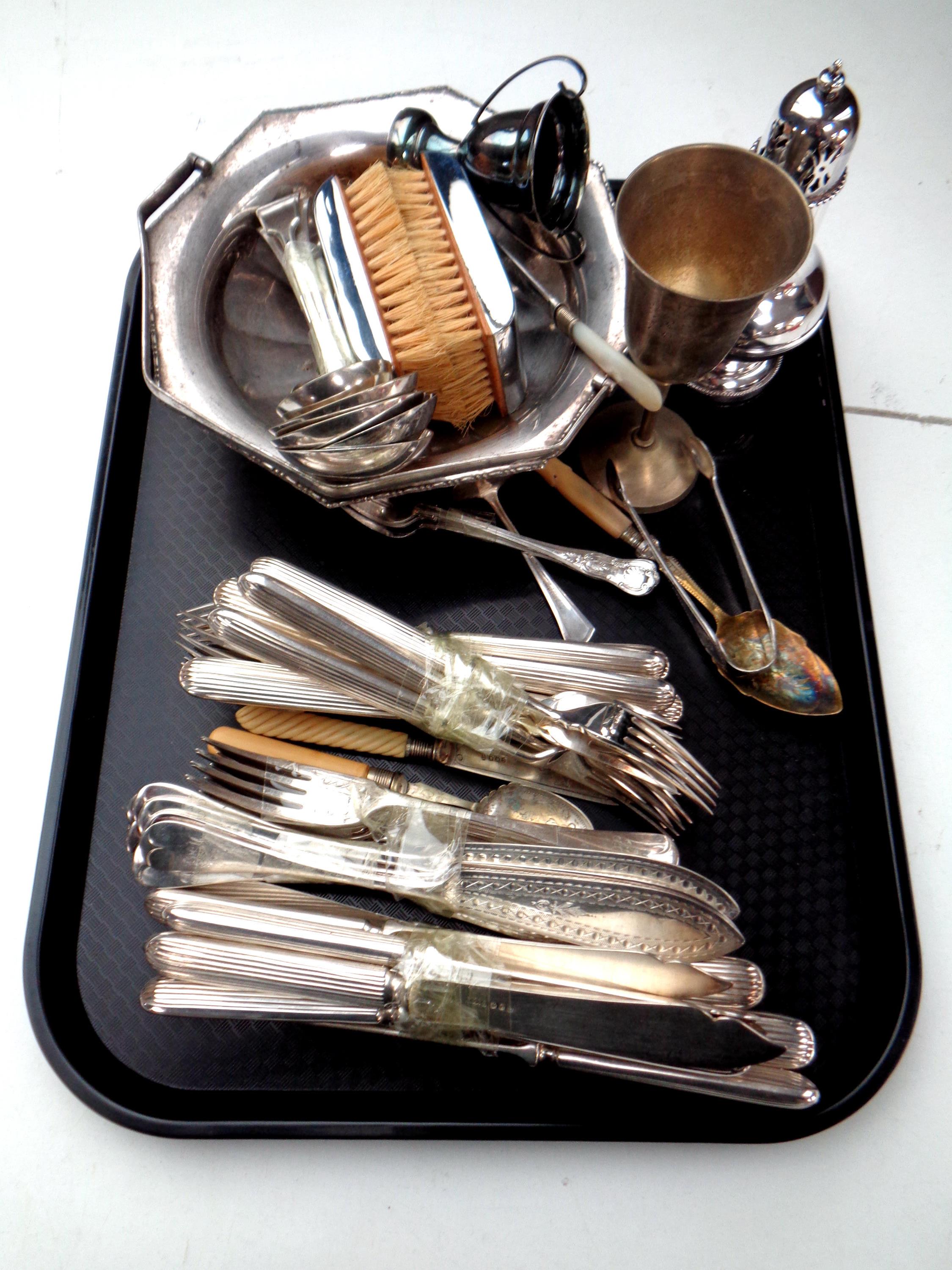 A tray containing a quantity of plated cutlery, small trophy cup, sugar sifter,