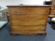 A 19th century elm four drawer chest