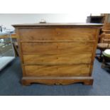 A 19th century elm four drawer chest