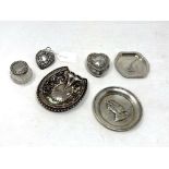Six items of silver to include three small dishes, heart shaped trinket pot,