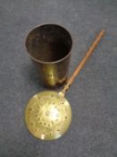 A brass bed warming pan together with a brass stick pot