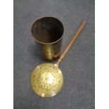 A brass bed warming pan together with a brass stick pot