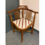 An Edwardian inlaid beech wood corner chair