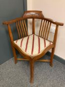 An Edwardian inlaid beech wood corner chair