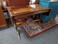 A mahogany flap sided table together with a stool and an elephant plant stand