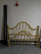 A brass effect traditional style 4'6 bed frame